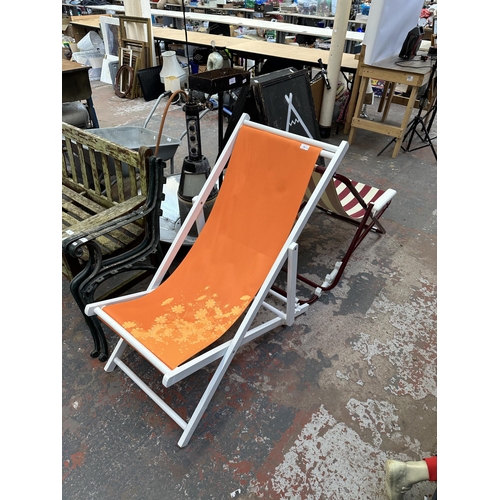 945 - Two folding sun loungers