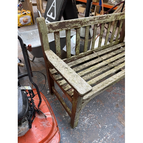 947 - A wooden garden bench