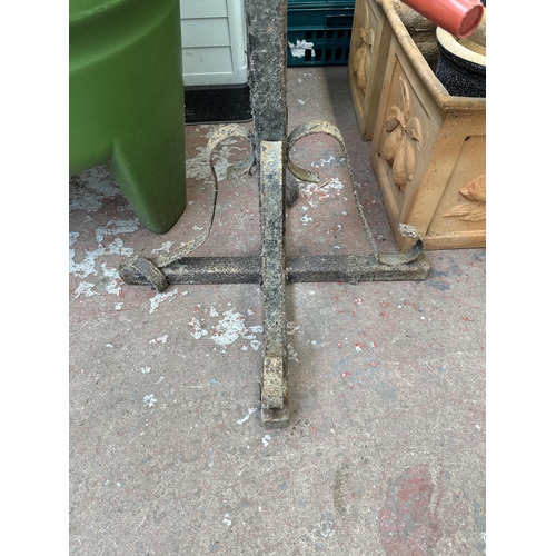 971 - A wrought iron coat rack - approx. 200cm high