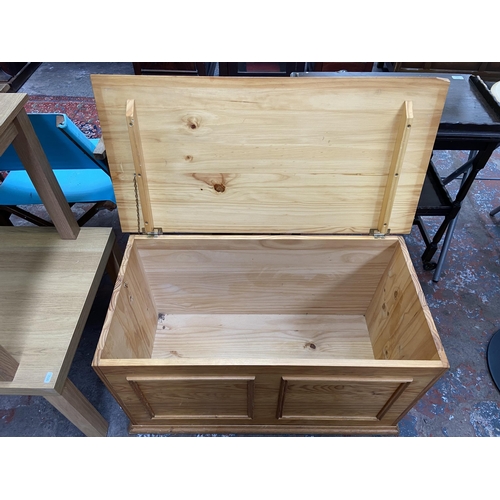 104 - Three blanket/storage boxes, one pine, one Arnold Designs Ltd. fibreglass and one straw dome top