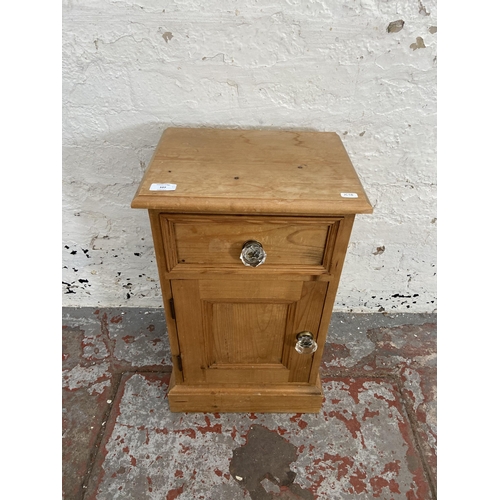 107 - A Victorian style pine bedside cabinet - approx. 61cm high x 46 cm wide x 28cm deep