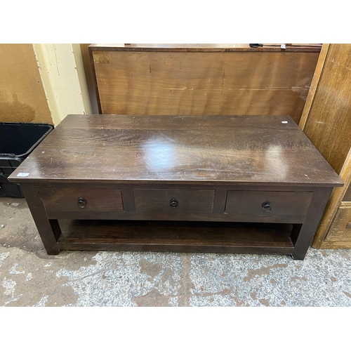 110 - A modern hardwood rectangular six drawer coffee table - approx. 45cm high x 61cm wide x 120cm long