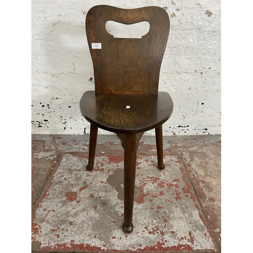 111 - An oak spinning/weaver's chair - approx. 77cm high