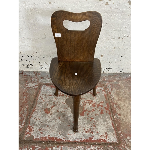 111 - An oak spinning/weaver's chair - approx. 77cm high