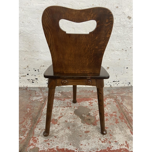 111 - An oak spinning/weaver's chair - approx. 77cm high