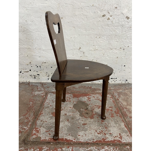 111 - An oak spinning/weaver's chair - approx. 77cm high