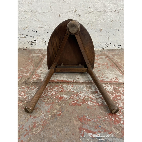 111 - An oak spinning/weaver's chair - approx. 77cm high