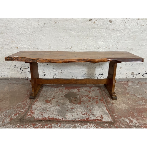 116 - A yew wood tree slice coffee table on oak base - approx. 44cm high x 43cm wide x 125cm long