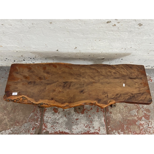 116 - A yew wood tree slice coffee table on oak base - approx. 44cm high x 43cm wide x 125cm long