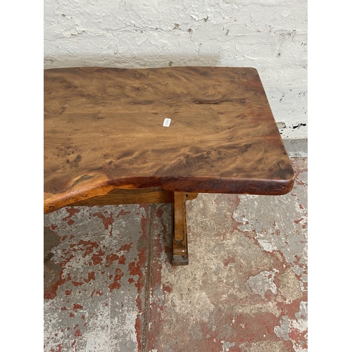 116 - A yew wood tree slice coffee table on oak base - approx. 44cm high x 43cm wide x 125cm long