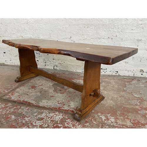 116 - A yew wood tree slice coffee table on oak base - approx. 44cm high x 43cm wide x 125cm long