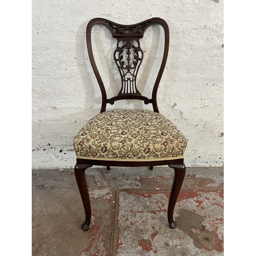 118 - Four late Victorian/Edwardian carved mahogany and floral fabric upholstered dining chairs