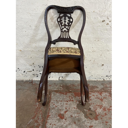 118 - Four late Victorian/Edwardian carved mahogany and floral fabric upholstered dining chairs