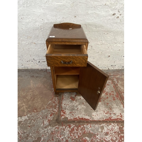 125 - An Art Deco oak bedside cabinet - approx. 74cm high x 34cm wide x 33cm deep