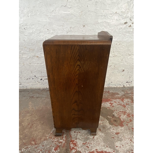 125 - An Art Deco oak bedside cabinet - approx. 74cm high x 34cm wide x 33cm deep