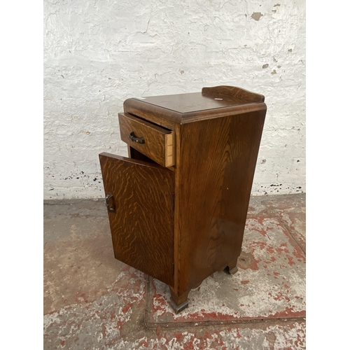 125 - An Art Deco oak bedside cabinet - approx. 74cm high x 34cm wide x 33cm deep