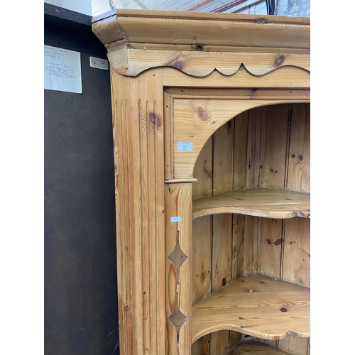 131 - A 19th century style pine free standing corner cabinet - approx. 198cm high