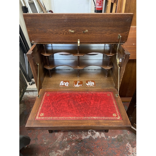 137 - An Old Charm carved oak linenfold cocktail cabinet - approx. 110cm high x 76cm wide x 28cm deep