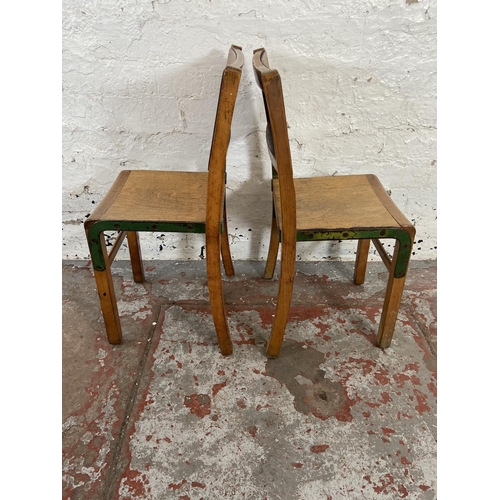 138 - A pair of mid 20th century beech and plywood child's chairs