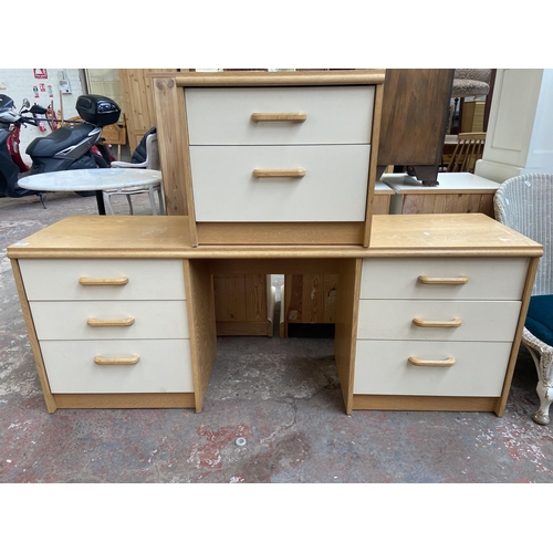 139 - A mid/late 20th century oak effect and white laminate dressing table and bedside cabinet