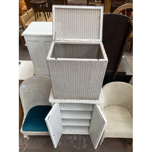 140 - Five pieces of white painted woven furniture to include Lloyd Loom corner linen basket, W. Lusty & S... 