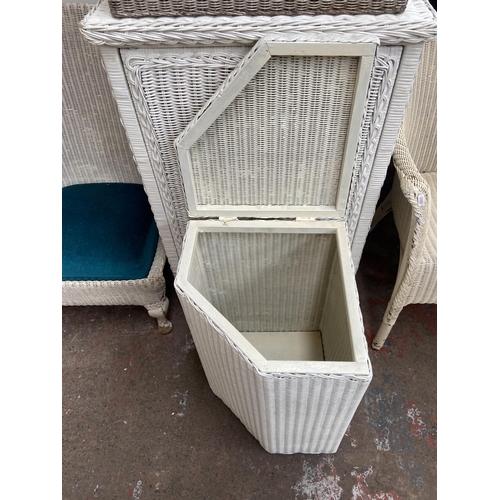 140 - Five pieces of white painted woven furniture to include Lloyd Loom corner linen basket, W. Lusty & S... 