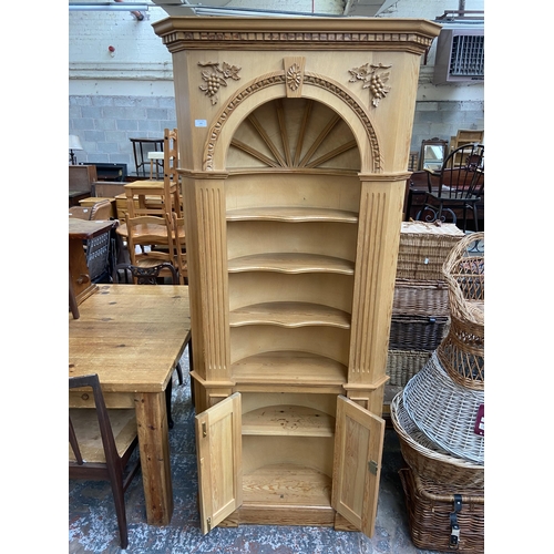 142 - A 19th century style carved pine free standing corner cabinet - approx. 206cm high x 94cm wide