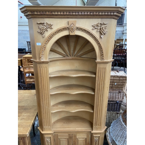 142 - A 19th century style carved pine free standing corner cabinet - approx. 206cm high x 94cm wide