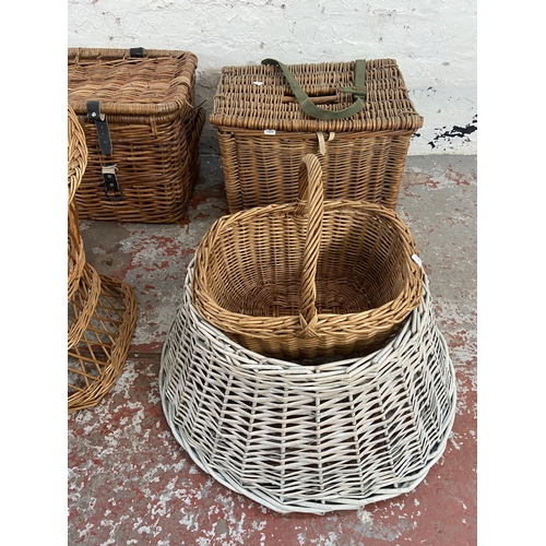 143 - Seven pieces of wicker furniture to include fishing basket, child's chair etc.