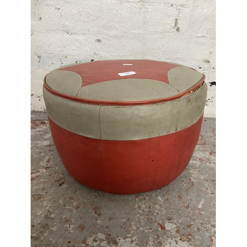 145 - A mid 20th century red and grey vinyl circular footstool - approx. 25cm high x 40cm diameter