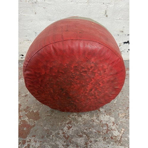 145 - A mid 20th century red and grey vinyl circular footstool - approx. 25cm high x 40cm diameter