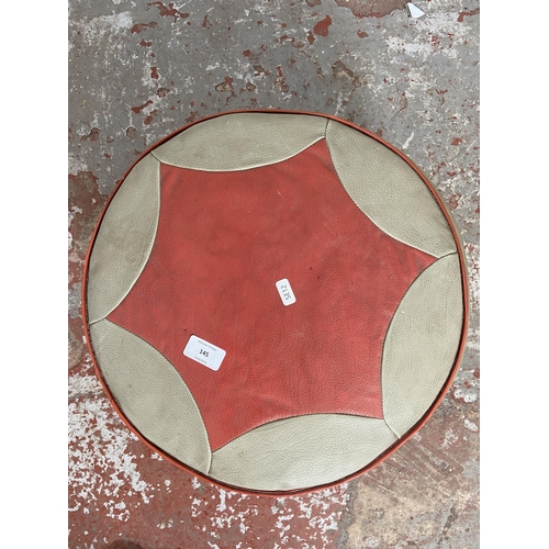 145 - A mid 20th century red and grey vinyl circular footstool - approx. 25cm high x 40cm diameter