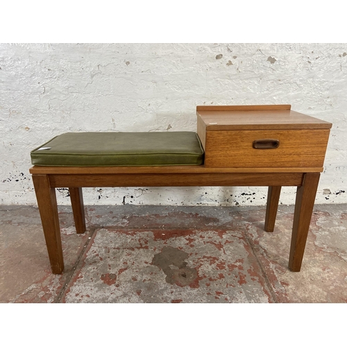 146 - A mid 20 century teak telephone table - approx. 59cm high x 96cm wide x 31cm deep