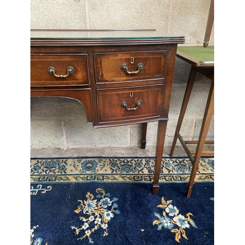 15 - An Edwardian inlaid mahogany bow fronted writing desk - approx. 76cm high x 104cm wide x 55cm deep