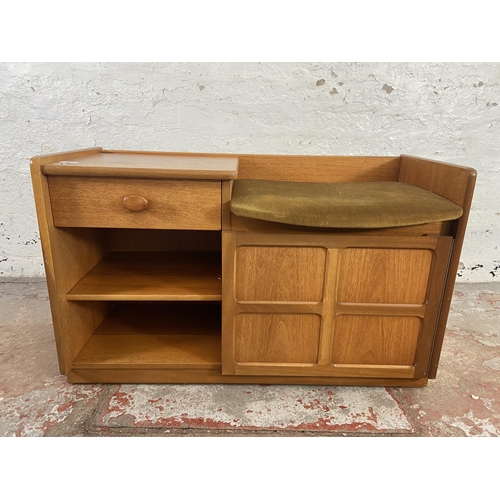 153 - A mid 20th century Nathan teak and green fabric upholstered telephone table - approx. 57cm high x 92... 