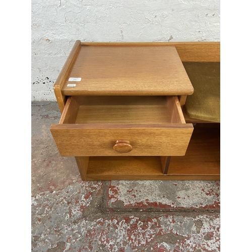 153 - A mid 20th century Nathan teak and green fabric upholstered telephone table - approx. 57cm high x 92... 