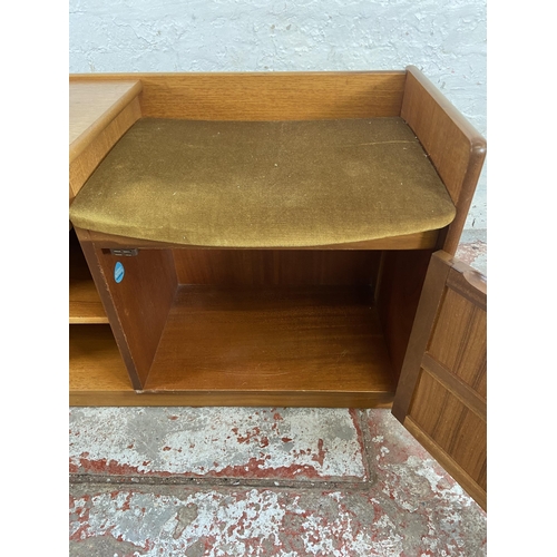 153 - A mid 20th century Nathan teak and green fabric upholstered telephone table - approx. 57cm high x 92... 