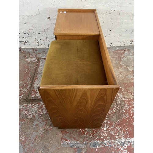 153 - A mid 20th century Nathan teak and green fabric upholstered telephone table - approx. 57cm high x 92... 