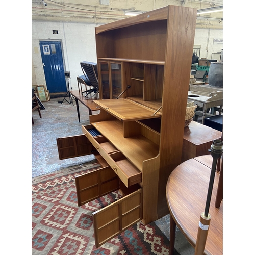 155 - A mid 20th century Nathan teak display cabinet - approx. 194cm high x 153cm wide x 45cm deep