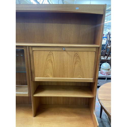 155 - A mid 20th century Nathan teak display cabinet - approx. 194cm high x 153cm wide x 45cm deep