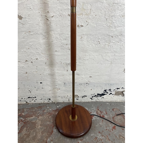 157A - A mid 20th century teak and brass standard lamp - approx. 142cm high