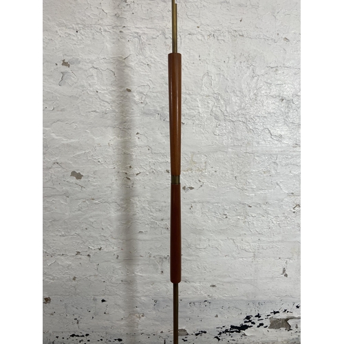 157A - A mid 20th century teak and brass standard lamp - approx. 142cm high