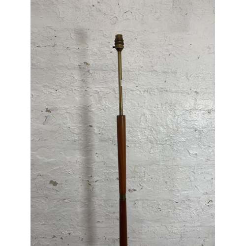 157A - A mid 20th century teak and brass standard lamp - approx. 142cm high