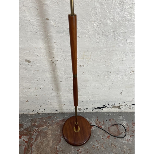 157A - A mid 20th century teak and brass standard lamp - approx. 142cm high