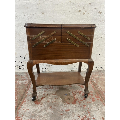 161 - A mid 20th century Morco beech concertina sewing box on castors - approx. 64cm high x 52cm wide x 29... 