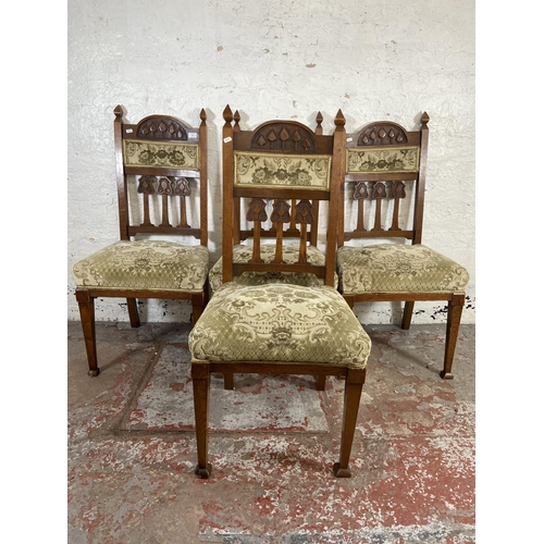 166 - Four Arts & Crafts carved oak and floral fabric upholstered dining chairs - approx. 107cm high x 50c... 