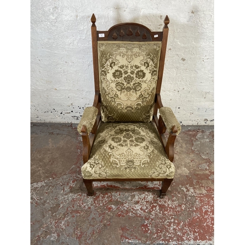 167 - An Arts & Crafts carved oak and floral fabric upholstered parlour armchair - approx. 115cm high x 65... 