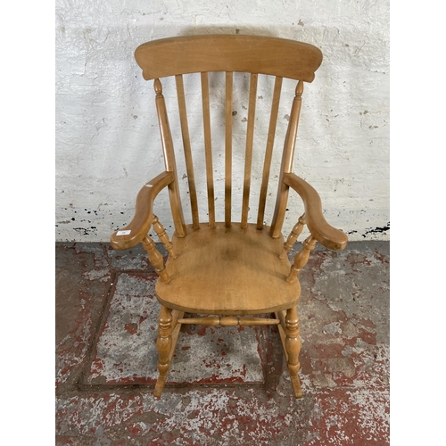 168 - A Victorian style beech farmhouse rocking chair