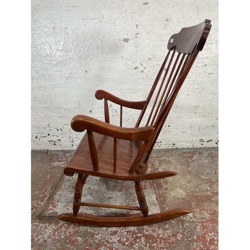 169 - A Victorian style stained beech farmhouse rocking chair