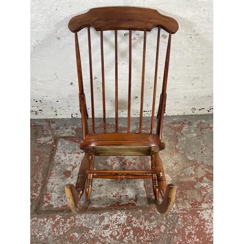 169 - A Victorian style stained beech farmhouse rocking chair